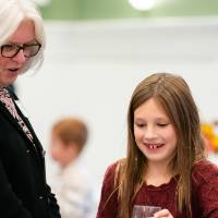 Two people getting drinks